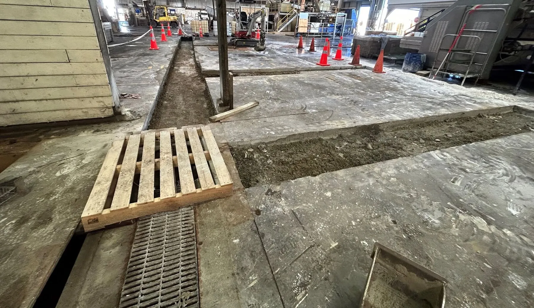 Finished slot drain with steel grating sitting flush in a Timaru factory floor