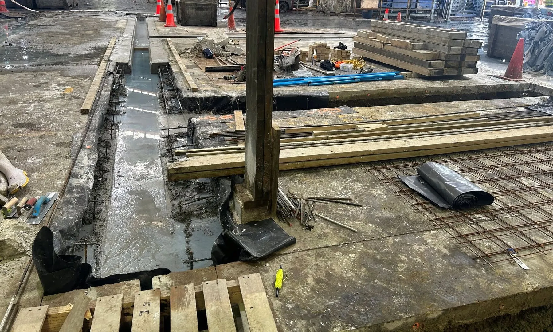 Formed slot drain opening on a Timaru factory floor, built to suit the client's steel grating